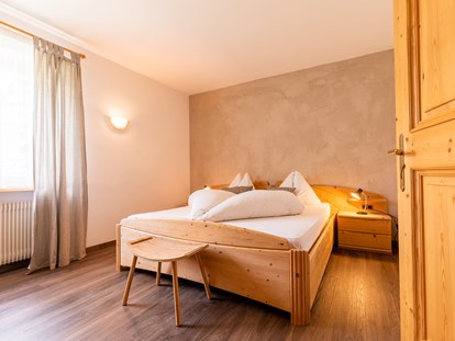 Pensionen - Umgebungsschwerpunkt: Berg - Italien - Schlafzimmer 2 Gardensuite Apartment LATEMAR - Haus Christian 