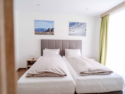 Pensionen - Langlaufloipe - Schlafzimmer im Hohe Burg Appartement - Alpengasthof Hohe Burg